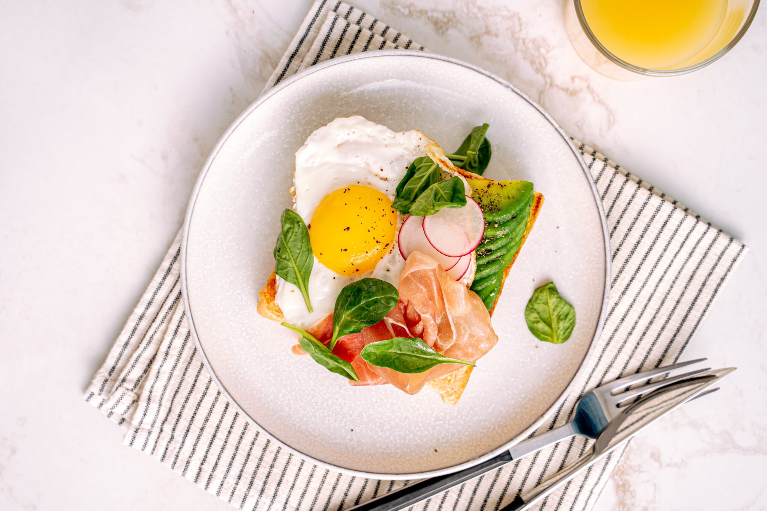 Avocado toast topped with eggs.